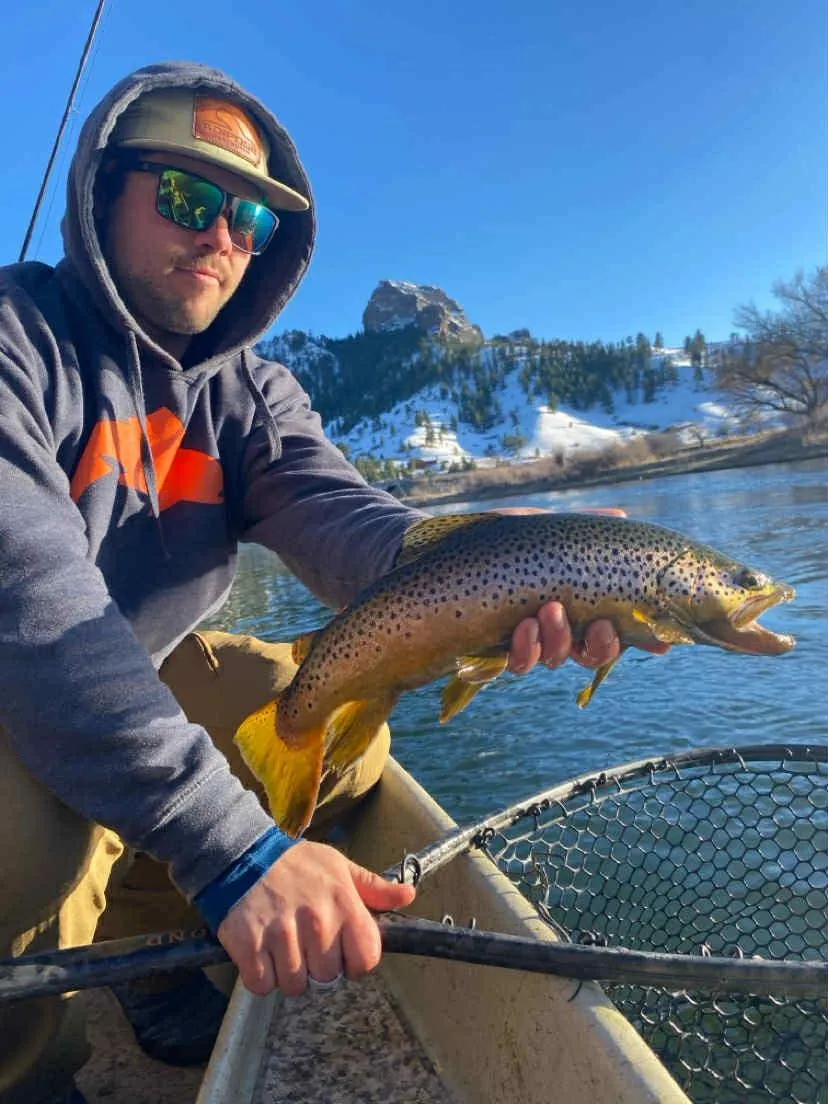 Sam Botz with a brown trout on the Missouri River